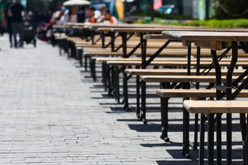 Fototapeta na wymiar empty tables on restaurant summer terrace