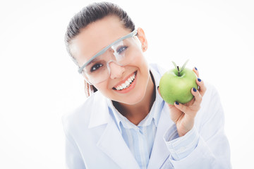 Dentist medical doctor woman hold green fresh apple in hand and tooth brush. Dentist doctors. Woman...