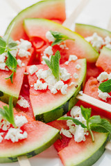Served watermelon slices with cheese