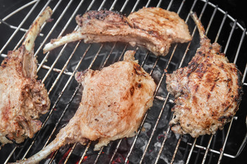 Cooking of appetizing juicy spare ribs outdoors