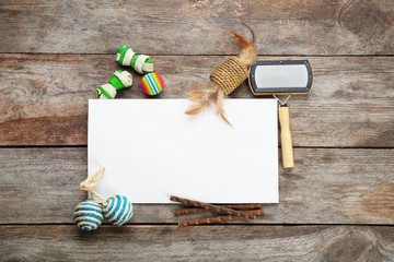Flat lay composition with cat accessories on wooden background