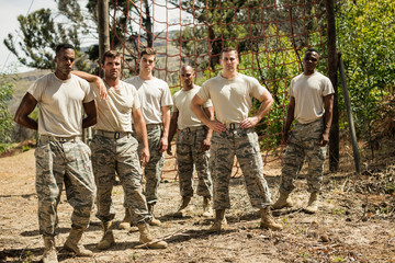 Military soldiers standing near fitness trial