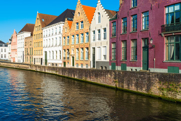 Fototapeta na wymiar View of a canal and old historical buildings in Bruges, Belgium