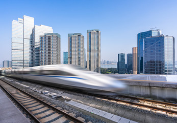 Fototapeta na wymiar high speed train with modern building