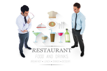 Unsmiling businessman holding glasses against restaurant advertisement