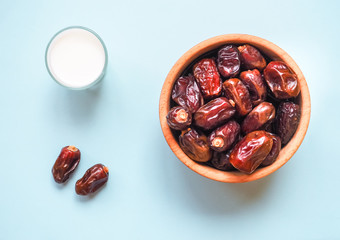 Sweet food for ramadan. Conceptual photo of Ramadan food:dates palm and milk.
