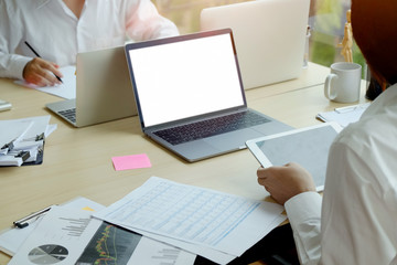 Business woman working new project with laptop and tablet in office.