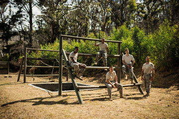 Soldiers sitting on the obstacle course in bootcamp