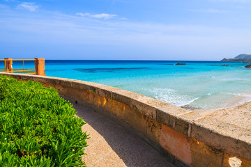 Coastal path along beautiful bay with beach, Majorca island, Spain