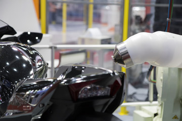 Spray painting robot and body part