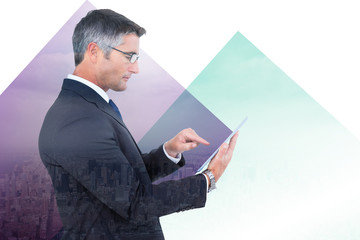 Mid section of a businessman touching tablet against clouds over city