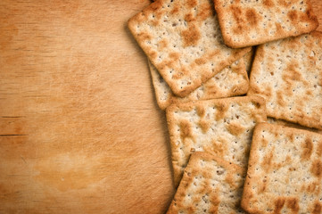 Crackers on wooden tray