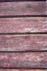 Wooden boards worn with paint.