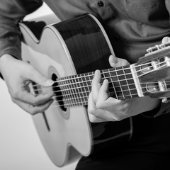 Fototapeta premium Man Playing Classic Guitar from THAILAND isolated for white background