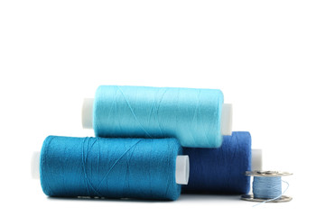 Blue thread spools isolated on a white