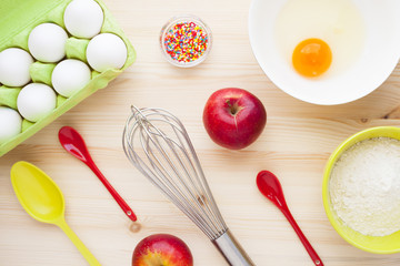 Ingredients for baking on the wooden background. Сookery, food, confectionery and home kitchen concept. Top view. Close up.