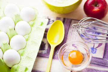 Ingredients for baking on the wooden background. Сookery, food, confectionery and home kitchen concept. Top view. Close up.