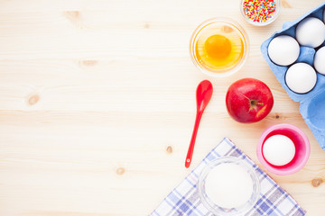 Ingredients for baking on the wooden background. Сookery, food, confectionery and home kitchen concept. Top view. Close up.