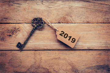 Business concept old key vintage with tag for New Year Resolution 2019.