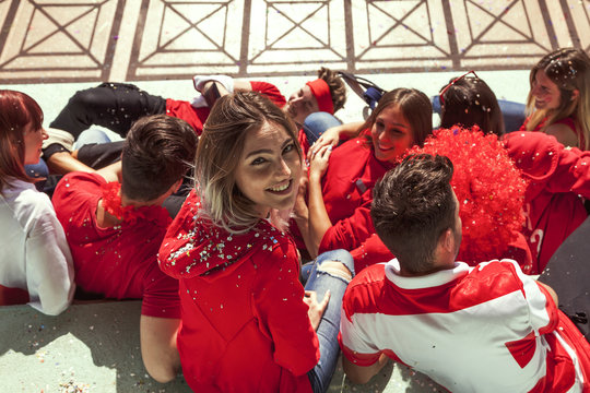 young group of supporter fans relaxing lying down