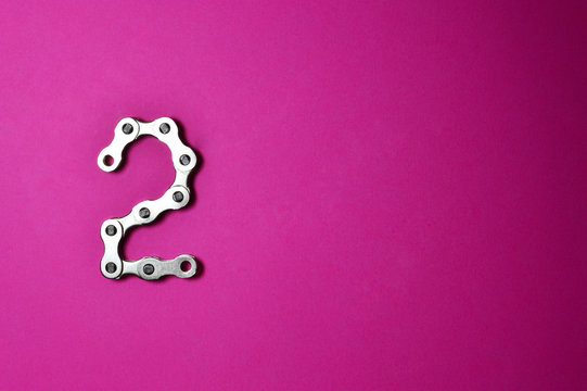 bike chain number two on pink background