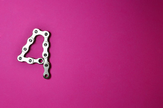 bike chain number four on pink background