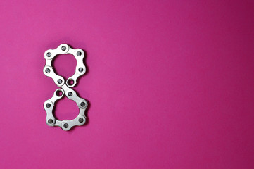 bike chain number eight on pink background