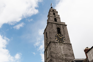 Fototapeta na wymiar St. Anne's Church & Shandon Bells Tower, a church located in the Shandon district of Cork city in Ireland. It is situated atop a hill overlooking the River Lee.