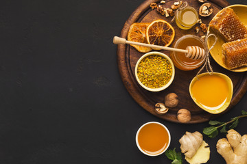 Naklejka na ściany i meble Various types of honey on wooden platter
