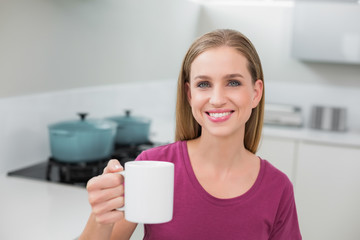 Blonde casual woman holding mug