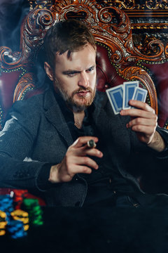 mature man playing poker
