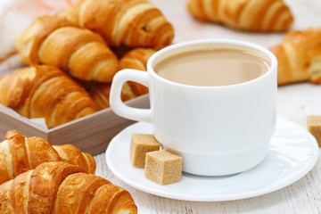 White coffee and croissant for breakfast