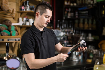 Male barista making payment