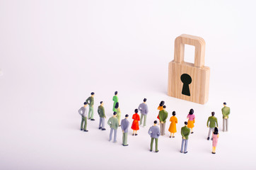 A crowd of people looks at the padlock. The concept of security, cyber-security and privacy of...