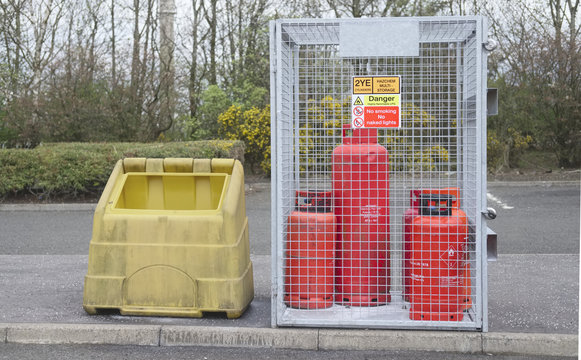 Highly flammable gas propane cylinders store cage for safety near construction building site and the public protection from explosion