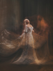 The legend of the Banshee fairy. Pale girl blonde, like a ghost, in a white vintage dress, flies,...