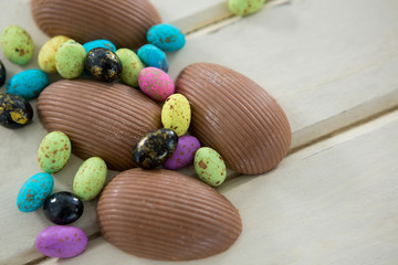 Fototapeta na wymiar Chocolate Easter eggs on wooden plank