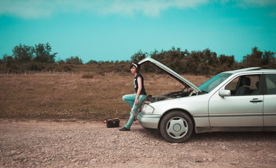 Fashion woman having troubles with the car