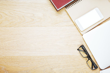 Wooden table with office items and devices