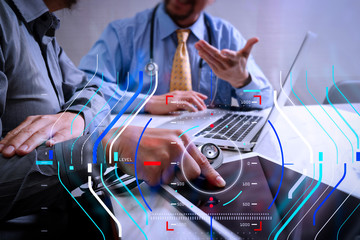 Medical technology network team meeting concept. Doctor hand working smart phone modern digital tablet laptop computer graphics chart interface, sun flare effect photo