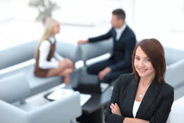 successful young business woman on blurred background office