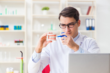 Young dentist working in the dentistry hospital