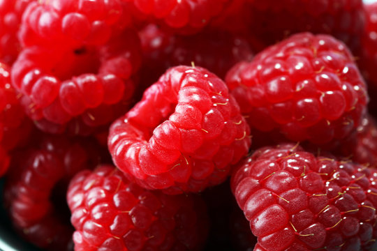 raspberries. Raspberry on blue background. Summer and healthy food concept