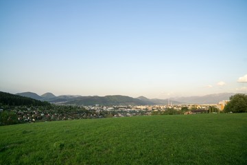 Fototapeta premium Sunrise and sunset over the hills and town. Slovakia