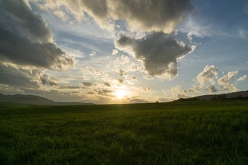 Obraz na płótnie Canvas Sunrise and sunset over the hills and town. Slovakia