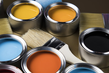 Paint brush, tin can and color guide samples.