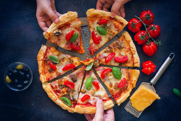 Family sharing fresh homemade pizza 