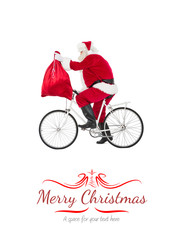 Santa cycling and holding his sack against border