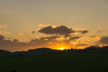 Naklejka na ściany i meble Sunset on meadow with hills and tree. Slovakia