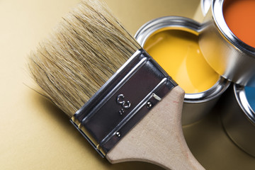 Tin metal cans with color paint and paintbrush